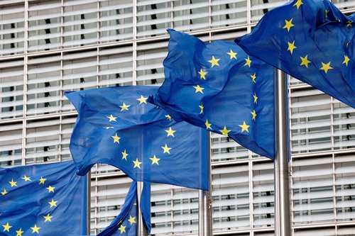 FILE PHOTO: European Union flags flutter outside the EU Commission headquarters in Brussels, Belgium