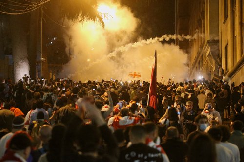 FILE PHOTO: Demonstrators hold a rally to protest against a bill on "foreign agents", in Tbilisi