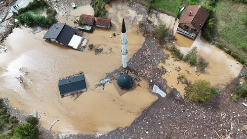 A drone view shows a flooded residential area and mosque in Donja Jablanica