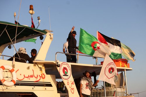 FILE PHOTO: Crew interacts from aboard a boat, part of the Global Sumud Flotilla aiming to reach Gaza and break Israel's naval blockade, as it sails off Koufonisi islet, Greece, September 26, 2025. REUTERS/Stefanos Rapanis/File Photo