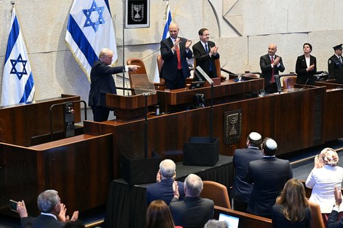 U.S. President Donald Trump gestures while addressing the Knesset