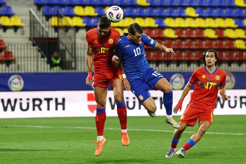 Soccer Football - FIFA World Cup - UEFA Qualifiers - Group K - Andorra v Serbia - Nou Estadi d'Encamp, Encamp, Andorra - October 14, 2025 Andorra's Christian Garcia in action with Serbia's Lazar Samardzic REUTERS/Albert Gea