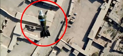 A mortar round falls towards a target from a drone