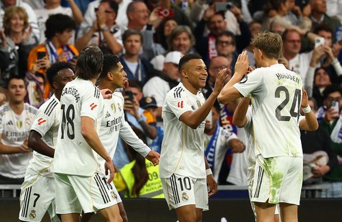 Soccer Football - LaLiga - Real Madrid v FC Barcelona - Santiago Bernabeu, Madrid, Spain - October 26, 2025 Real Madrid's Kylian Mbappe celebrates scoring their first goal with teammates REUTERS/Susana Vera