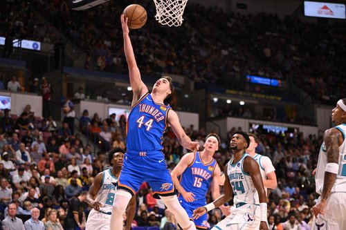 Oct 5, 2025; North Charleston, South Carolina, USA; Oklahoma City Thunder guard Nikola Topic (44) lays up a shot against the Charlotte Hornets in the first quarter at North Charleston Coliseum. Mandatory Credit: Arthur Ellis-Imagn Images