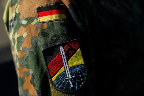 A logo of the Center for Cyber Operations is seen on a jacket of a soldier at the site of German army Bundeswehr, in Rheinbach