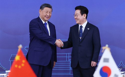 China's President Xi Jinping shakes hands with South Korea's President Lee Jae Myung during their meeting in Gyeongju, South Korea, November 1, 2025.