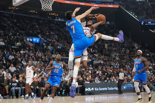 OKlahoma Derrick Jones Jr. (5) shoots the ball against Oklahoma City Thunder center Chet Holmgren (7)