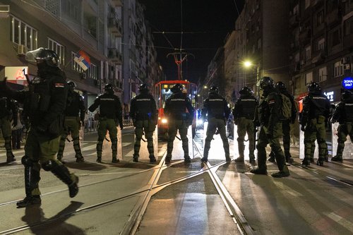 Law enforcement officers in riot gear stand guard during a protest demanding accountability for the Novi Sad railway station roof collapse, in Belgrade, Serbia, November 4, 2025. REUTERS/Djordje Kojadinovic