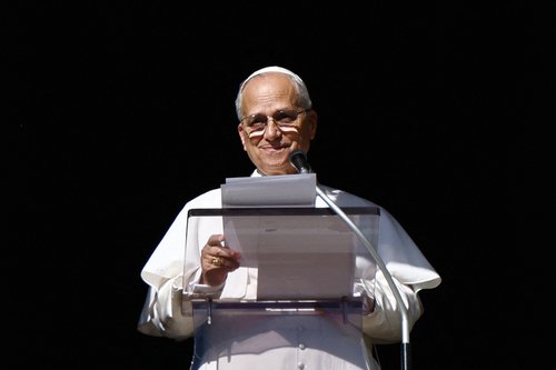 Pope Leo XIV leads the Angelus prayer from the window of the Apostolic Palace at the Vatican