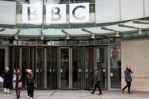 FILE PHOTO: An image of British Broadcasting Corporation (BBC) Director-General Tim Davie is seen through the door at the BBC headquarters in London