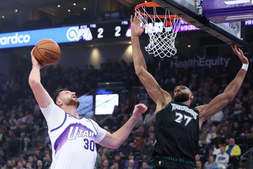 Nov 10, 2025; Salt Lake City, Utah, USA; Utah Jazz center Jusuf Nurkic (30) goes to the basket against Minnesota Timberwolves center Rudy Gobert (27) during the first quarter at Delta Center. Mandatory Credit: Rob Gray-Imagn Images