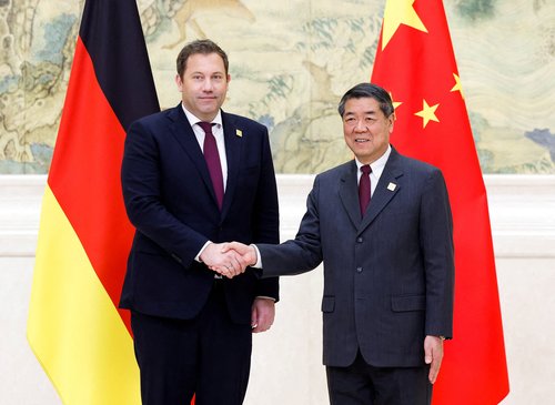 German Vice Chancellor and Finance Minister Lars Klingbeil and China's Vice Premier He Lifeng shake hands