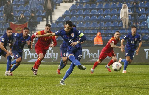 Soccer Football - World Cup - UEFA Qualifiers - Group L - Montenegro v Croatia - Podgorica City Stadium, Podgorica, Montenegro - November 17, 2025 Croatia's Ivan Perisic scores their first goal from the penalty spot REUTERS/Stevo Vasiljevic