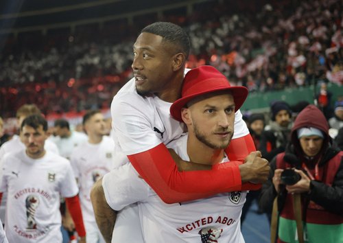Soccer Football - FIFA World Cup - UEFA Qualifiers - Group H - Austria v Bosnia and Herzegovina - Ernst-Happel-Stadion, Vienna, Austria - November 18, 2025 Austria's Marko Arnautovic and David Alaba celebrate after winning their group to qualify for the W
