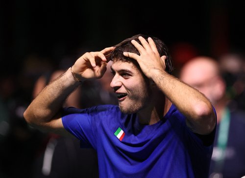 Tennis - Davis Cup - Final 8 - Final - Italy v Spain - SuperTennis Arena, Bologna, Italy - November 23, 2025 Italy's Flavio Cobolli celebrates after winning the Davis Cup REUTERS/Guglielmo Mangiapane