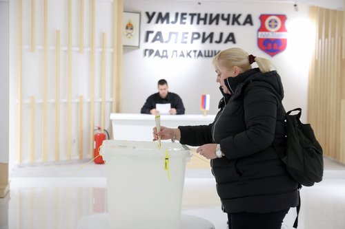 A Bosnian Serb votes during the Serb Republic's