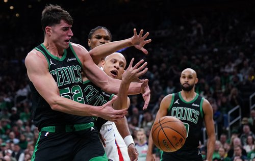 Nov 26, 2025; Boston, Massachusetts, USA; Boston Celtics center Luka Garza (52) and guard Jordan Walsh (27) work for the ball against the Detroit Pistons in the first quarter at TD Garden. Mandatory Credit: David Butler II-Imagn Images