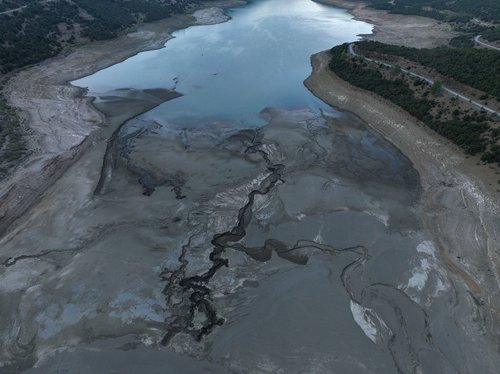 FILE PHOTO: A drone view shows a dried part of Lake Mornos, Lake Mornos, Greece, September 3, 2024. REUTERS/Stelios Misinas/File Photo