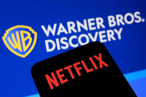 Netflix and Warner Bros Discovery logos are seen in this illustration