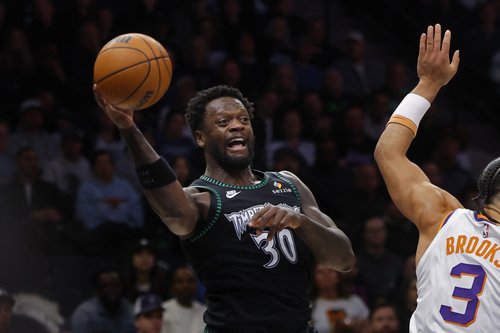 Dec 8, 2025; Minneapolis, Minnesota, USA; Minnesota Timberwolves forward Julius Randle (30) passes against the Phoenix Suns in the third quarter at Target Center. Mandatory Credit: Bruce Kluckhohn-Imagn Images