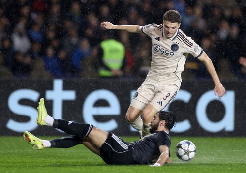 Soccer Football - UEFA Champions League - Qarabag v Ajax Amsterdam - Tofiq Bahramov Republican Stadium, Baku, Azerbaijan - December 10, 2025 Ajax Amsterdam's Anton Gaaei in action with Qarabag's Elvin Cafarquliyev REUTERS/Aziz Karimov