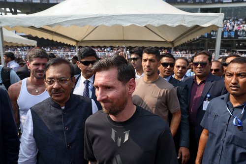 Soccer Football - Argentine soccer star Lionel Messi on a whirlwind tour of India - Vivekananda Yuva Bharati Krirangan, Kolkata, India - December 13, 2025 Argentine soccer star Lionel Messi with his Inter Miami teammates Rodrigo De Paul and Luis Suarez at