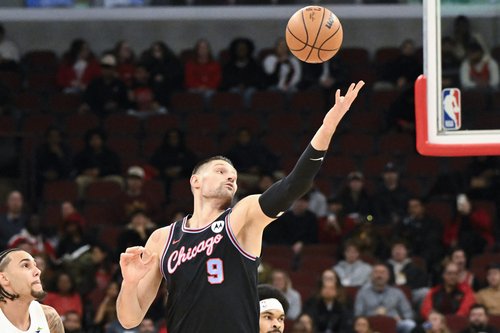 Dec 17, 2025; Chicago, Illinois, USA; Chicago Bulls center Nikola Vucevic (9) grabs a pass against the Cleveland Cavaliers during the first half at United Center. Mandatory Credit: Matt Marton-Imagn Images
