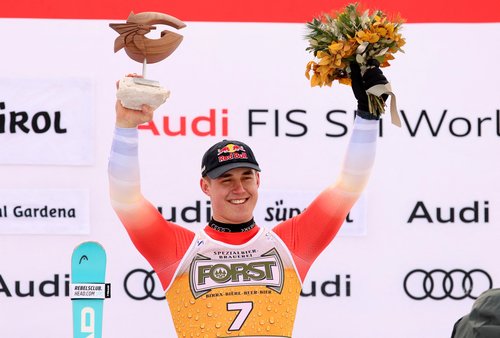 Alpine Skiing - FIS Alpine Ski World Cup - Men's Downhill - Val Gardena, Italy - December 20, 2025 Switzerland's Franjo Von Allmen celebrates on the podium after winning the men's downhill REUTERS/Leonhard Foeger