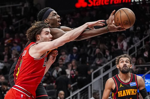 Dec 21, 2025; Atlanta, Georgia, USA; Atlanta Hawks forward Onyeka Okongwu (17) and Chicago Bulls guard Josh Giddey (3) battle for the ball during the second half at State Farm Arena. Mandatory Credit: Dale Zanine-Imagn Images