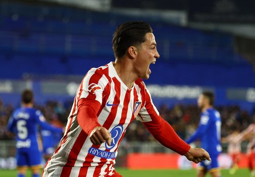 Soccer Football - LaLiga - Getafe v Atletico Madrid - Estadio Coliseum, Getafe, Spain - November 23, 2025 Atletico Madrid's Giacomo Raspadori celebrates their first goal, an own goal scored by Getafe's Domingos Duarte REUTERS/Susana Vera