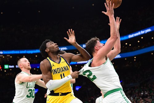 Dec 22, 2025; Boston, Massachusetts, USA; Indiana Pacers center James Wiseman (11) grabs the jersey of Boston Celtics center Luka Garza (52) during the second half at TD Garden. Mandatory Credit: Bob DeChiara-Imagn Images