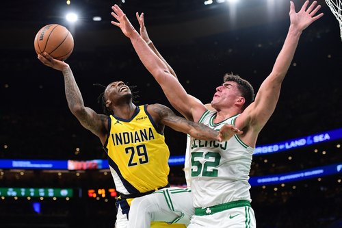 Dec 22, 2025; Boston, Massachusetts, USA; Indiana Pacers guard Quenton Jackson (29) gets fouled by Boston Celtics center Luka Garza (52) during the second half at TD Garden. Mandatory Credit: Bob DeChiara-Imagn Images