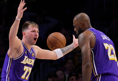 Dec 10, 2025; Los Angeles, California, USA; Los Angeles Lakers guard Luka Doncic (77) and forward Lebron James (23) react after a foul call during the second half against the San Antonio Spurs at Crypto.com Arena. Mandatory Credit: Jayne Kamin-Oncea-Imag
