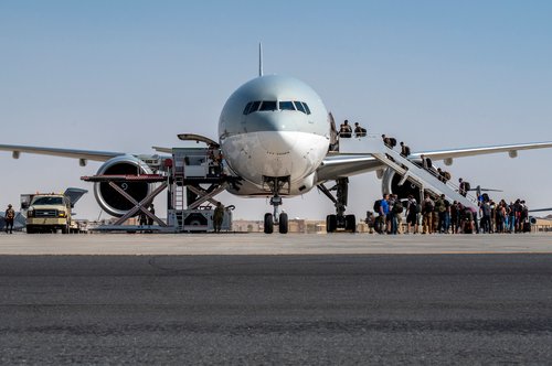 FILE PHOTO: U.S. Embassy personnel from Afghanistan board a Qatar Airways flight to Kuwait