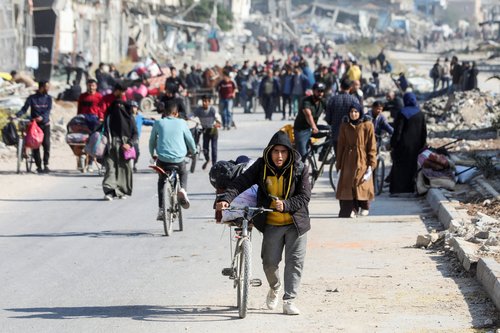 Displaced Palestinians flee the northern part of Gaza amid an Israeli military operation, in Gaza City