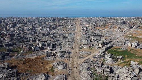 A drone view shows houses and buildings lying in ruins, following a ceasefire between Israel and Hamas, in the northern Gaza Strip