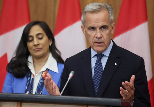Canada's Prime Minister Mark Carney speaks at a press conference about recognizing Palestinian statehood while Foreign Affairs Minister Anita Anand listens, in Ottawa, Ontario, Canada, July 30, 2025. REUTERS/Patrick Doyle TPX IMAGES OF THE DAY