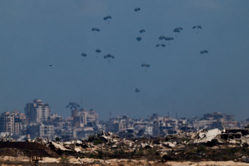 Humanitarian aid packages are airdropped over the Gaza Strip REUTERS/Amir Cohen