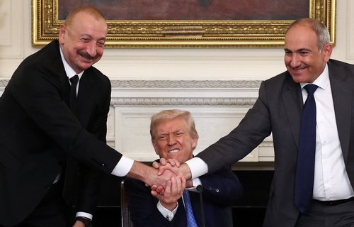 U.S. President Donald Trump holds the hands of Azerbaijan's President Ilham Aliyev and Armenia's Prime Minister Nikol Pashinyan
