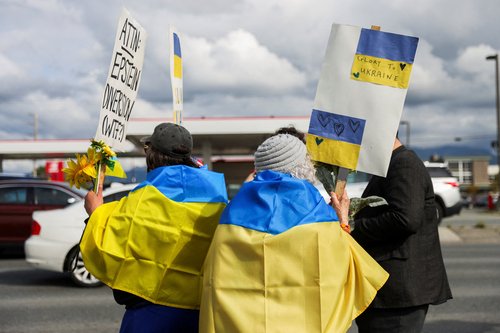 Demonstrators hold placards during a protest in solidarity with Ukraine, ahead of the meeting between U.S. President Donald Trump and Russian President Vladimir Putin, in Anchorage, Alaska, U.S., August 14, 2025. REUTERS/Nathaniel Wilder