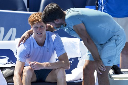 Aug 18, 2025; Cincinnati, OH, USA; Jannik Sinner (ITA), left, talks with Carlos Alcaraz (ESP) after retiring from their match during the Cincinnati Open at the Lindner Family Tennis Center. Mandatory Credit: Aaron Doster-Imagn Images