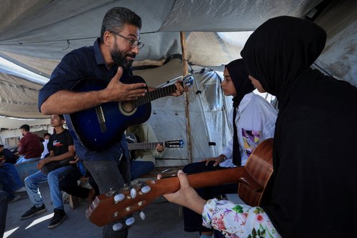 2025-08-14T080343Z_1983012171_RC2C0GAAWJ27_RTRMADP_3_ISRAEL-PALESTINIANS-GAZA-MUSIC