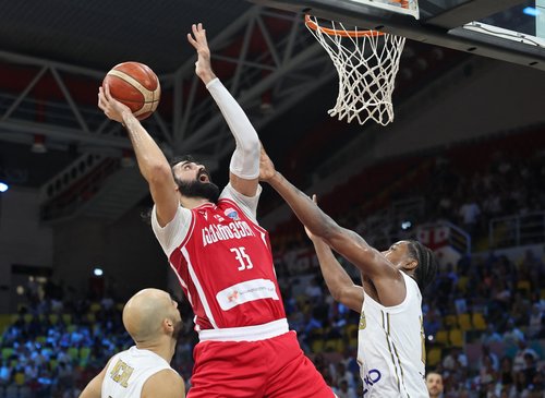 Basketball - FIBA EuroBasket 2025 - Group Phase - Cyprus v Georgia - Spyros Kyprianou Athletic Center, Limassol, Cyprus - September 2, 2025 Georgia's Goga Bitadze in action with Cyprus' Darral Willis Jr REUTERS/Yiannis Kourtoglou