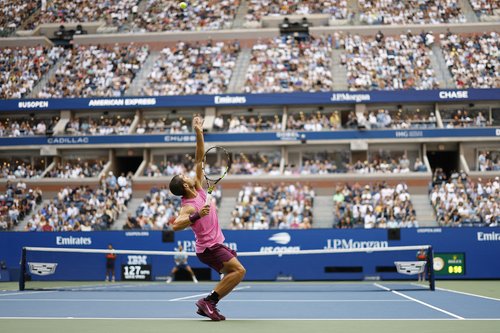 Sep 5, 2025; Flushing, NY, USA; Carlos Alcaraz (ESP) serves against Novak Djokovic