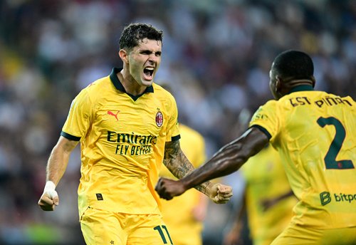 Soccer Football - Serie A - Udinese v AC Milan - Bluenergy Stadium, Udine, Italy - September 20, 2025 AC Milan's Christian Pulisic celebrates scoring their first goal with Pervis Estupinan REUTERS/Daniele Mascolo