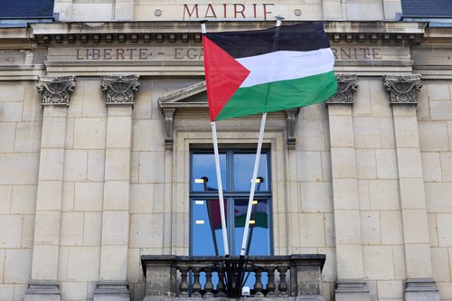 The Palestinian flag flies on the facade of the city hall in Saint-Ouen near Paris