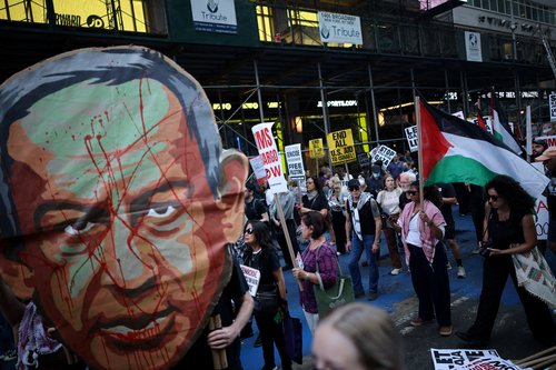 People attend a protest against Israeli Prime Minister Benjamin Netanyahu, as he delivers an address at the 80th United Nations General Assembly (UNGA) at the U.N. headquarters, in New York, U.S., September 26, 2025. REUTERS/Carlos Barria