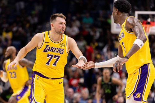 Jan 6, 2026; New Orleans, Louisiana, USA; Los Angeles Lakers forward/guard Luka Doncic (77) slaps hands with center Deandre Ayton (5) after a play against the New Orleans Pelicans during the second half at Smoothie King Center. Mandatory Credit: Stephen