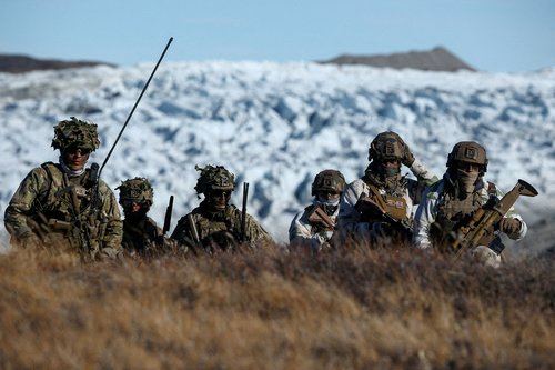 FILE PHOTO: Danish troops practice looking for potential threat
